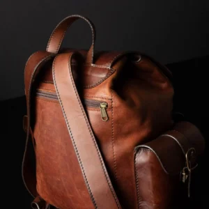 Close-up of Explorer Large Backpack in vintage brown leather, highlighting fine stitching and premium leather grain.