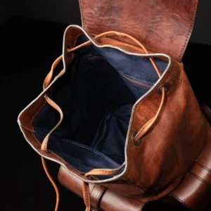 Interior view of Explorer Large Backpack in vintage brown leather, showing the spacious main compartment and drawstring closure.