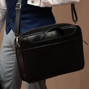 Model carrying the Astin Sleek black leather laptop bag, highlighting its professional and elegant appearance.