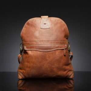 Women's Monroe 2-in-1 leather bag in rich brown, presented in its full backpack form with a zipped closure.