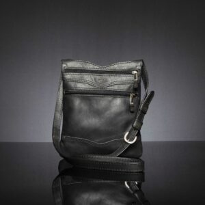 Women's Dakota Sling Bag in black leather, a stylish crossbody with zip pockets for essentials.