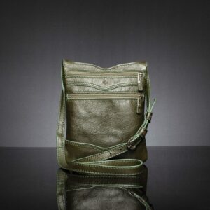 Women's Dakota Sling Bag in olive green leather, lightweight with secure zippers and an adjustable strap.