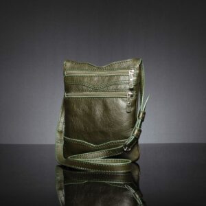 Side view of Women's Dakota Sling Bag in olive green, showing compartments and premium durable zippers.