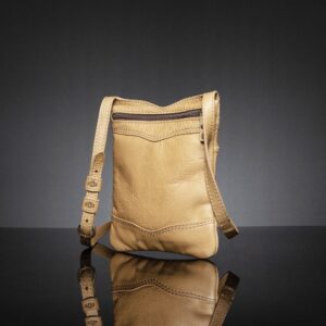 Back view of Women's Dakota Sling Bag in tan, highlighting the smooth leather surface and adjustable strap.