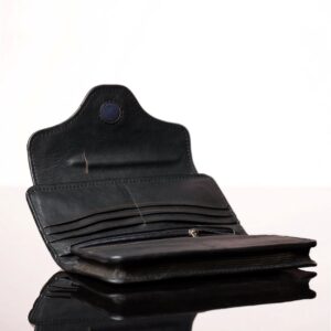 Inside compartments of a black leather Genevieve purse, showing 12 card slots, dual zip sections, and an expanding pouch for smartphone storage.