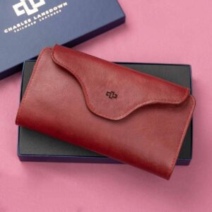 Women's ruby red leather Genevieve smart phone purse and clutch in a premium Charles Lansdown gift box, handcrafted with 12 card slots, dual zip compartments, and a magnetic closure.