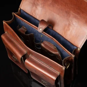 Interior of Benjamin Classic Laptop Bag, featuring two spacious compartments lined with royal blue suede for elegant organization.