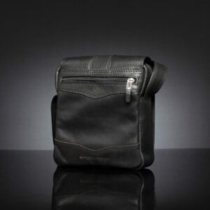 Black Indiana leather sling bag featuring an adjustable strap and multiple compartments for organized storage.