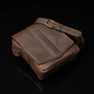 Brown Indiana men's leather sling bag, designed with multiple storage compartments and premium detailing.