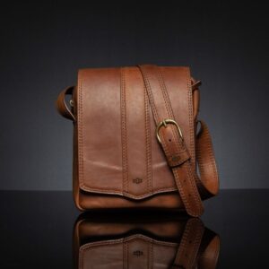 Rich brown Indiana leather sling bag with an adjustable strap, spacious interior, and classic styling.