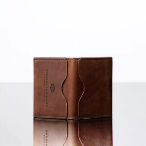 Close-up of men’s rich brown Dakota leather cardholder. Premium craftsmanship, curved slots, and embossed Charles Lansdown branding.