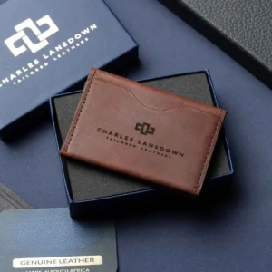 Men’s Dakota Bifold Cardholder in rich brown on a luxury gift box. Handcrafted full-grain leather with curved slots for sleek storage.