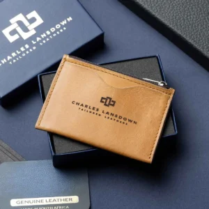 Men’s Dakota Zipped Cardholder in tan on a luxury gift box. Handcrafted full-grain leather with curved slots and a secure zip.