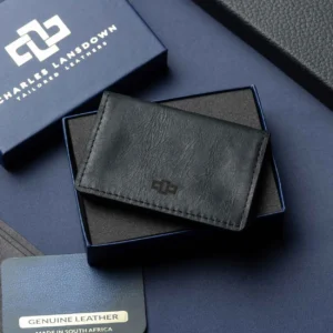 Men’s Harrington Pouched Cardholder in black on a luxury gift box. Premium full-grain leather with 5 card slots and an expanding pouch.