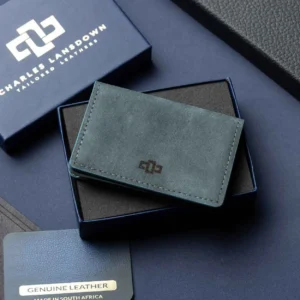 Men’s Harrington Pouched Cardholder in denim blue on a luxury gift box. Handcrafted leather with spacious storage and minimalist design.