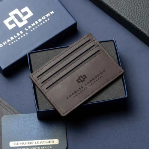 Men’s Mansfield V6 Cardholder in brown on a luxury gift box. Handcrafted full-grain leather with 7 card slots and a sleek, slim design.