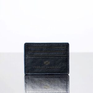Close-up of men’s navy blue Mansfield V6 Cardholder. Sleek leather finish, refined stitching, and embossed branding.