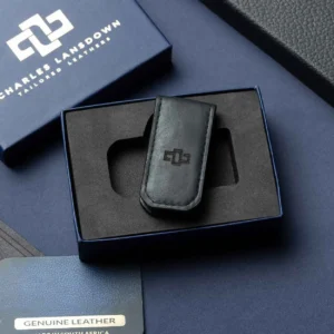 Men's black leather Belvoir money clip, elegantly placed in a Charles Lansdown gift box, featuring a strong magnetic clasp for secure note holding.