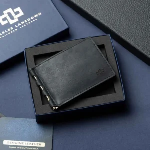 Men's Benjamin bifold wallet in black full-grain leather with brass money clip, elegantly displayed in a Charles Lansdown gift box.