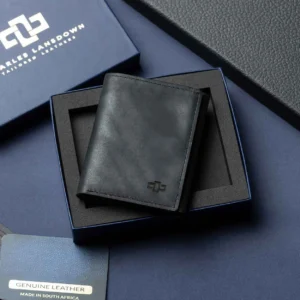 Men’s Ashford black leather trifold wallet displayed in an open Charles Lansdown gift box, designed for style and function.