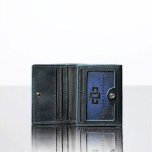 Inside view of the Ashford denim blue trifold wallet, highlighting the ID window, card slots, and craftsmanship details.