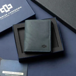 Men’s Ashford denim blue trifold wallet in full-grain leather, elegantly presented in an open Charles Lansdown gift box.