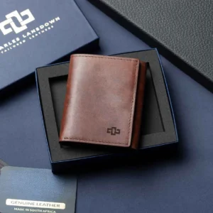 Men's Ashford Trifold Wallet in rich brown leather, displayed with a Charles Lansdown gift box, showcasing luxury and craftsmanship.