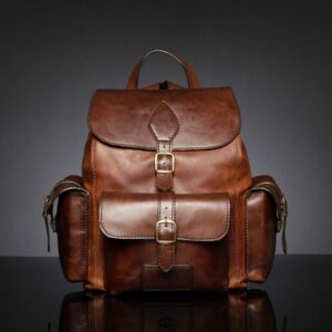 Explorer Large Backpack in rich brown leather, featuring a spacious design with structured front and side pockets.