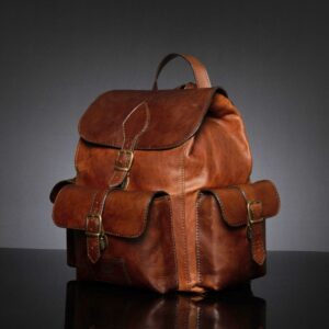 Front angle of Explorer Large Backpack in vintage brown leather, showcasing its durable structure and classic buckle closures.