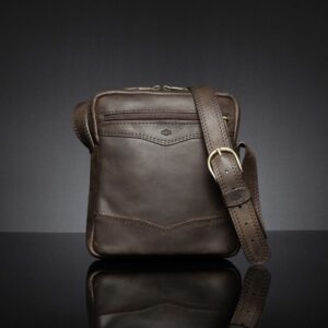 Montrose Sling Bag in rich brown leather, front view emphasizing its structured silhouette and durable craftsmanship.