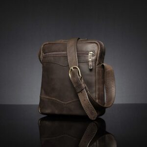Side view of the Montrose Sling Bag in rich brown leather, highlighting precise stitching and durable brass hardware.