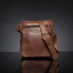 Montrose Sling Bag in rich brown genuine leather, compact design with a refined finish and classic structured shape.