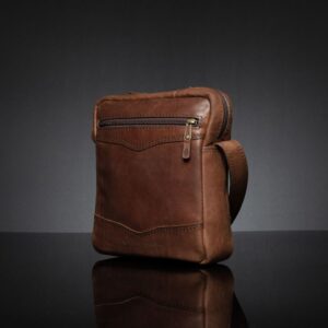 Montrose Sling Bag in rich brown leather, compact design with a structured silhouette and refined finish.
