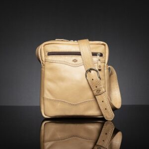 Montrose Sling Bag in tan genuine leather, front view showcasing fine craftsmanship and zippered compartments.