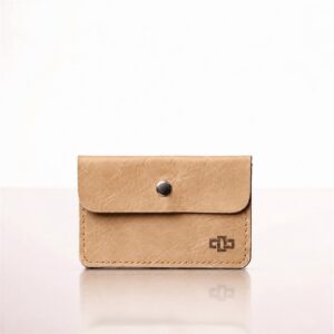 Women's Monroe envelope leather cardholder in desert tan, studio view.