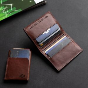 Women's bifold wallet in rich brown genuine leather, Mansfield model, shown open with visible card compartments.