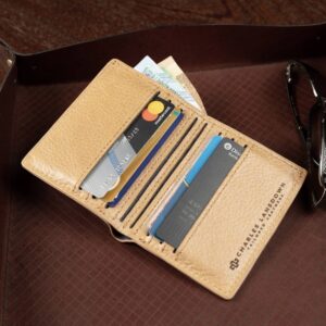 Women's bifold wallet in tan genuine leather, Mansfield model, shown open with card slots and premium stitching.