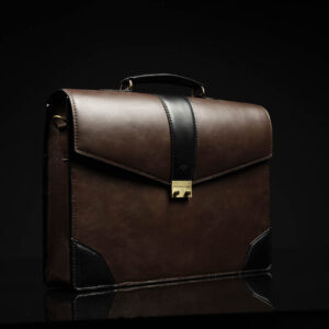 Side view of Svelte Laptop Bag, featuring a polished metal buckle and structured design.