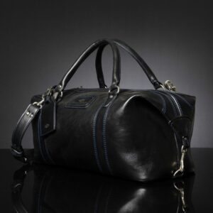 Side profile of Mansfield Duffle Bag in black leather, highlighting the sturdy construction.
