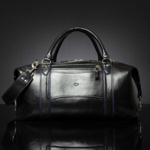 Back view of Mansfield Duffle Bag in black leather, a zip compartment and a over a suitcase strap.