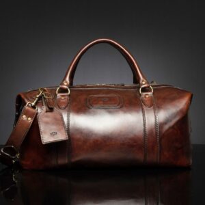Mansfield Duffle Bag in vintage brown leather, featuring a rich patina and timeless travel aesthetic.