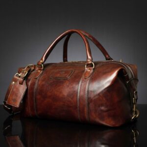 Angled view of Mansfield Duffle Bag in vintage brown leather, showcasing its handcrafted detailing and structured silhouette.