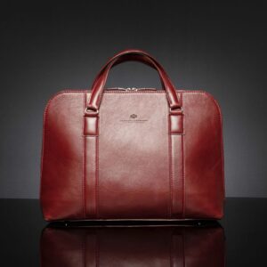 Women's Reagan Euro ruby red leather laptop bag, designed for bold style and professional elegance.