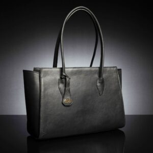 The Aria Tote Laptop Bag in black leather, featuring a sleek, structured body with flared sides for a spacious, elegant look.