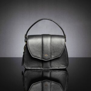 The women's Belle black leather side bag with a detachable handle and sling strap, offering multiple ways to carry.