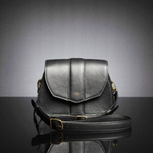 Women's Belle side bag showcasing its adjustable leather strap, designed for effortless transitions between styles.