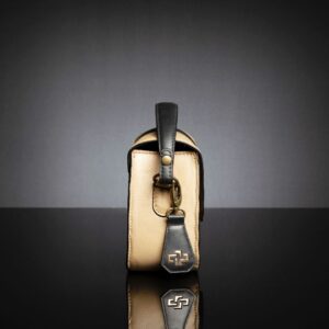 Side profile of the Belle genuine leather side bag, emphasizing fine stitching and a structured silhouette.