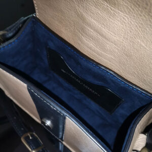 Close-up of the Belle genuine leather side bag interior, showing premium lining and organized compartments.