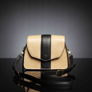 Women's Belle genuine leather side bag in tan, featuring a structured design with an adjustable sling strap.