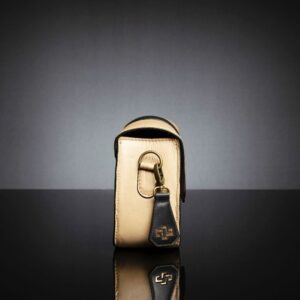 Side profile of the Belle genuine leather side bag in tan, featuring a compact and structured silhouette.